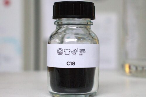 Liquid, dark pigment in a small bottle.