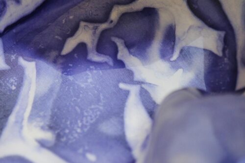 White fabric, partially dyed blue.