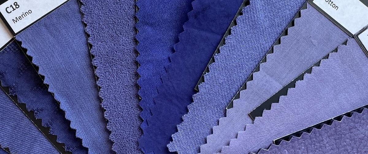 Differently blue coloured textile stripes.