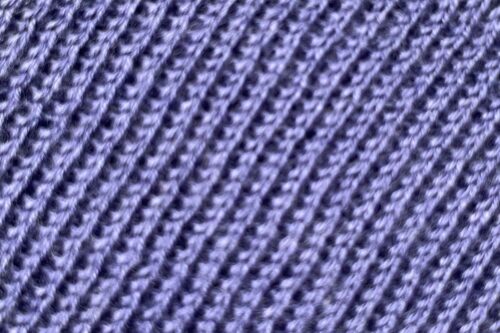 Detail of a blue coloured fabric.